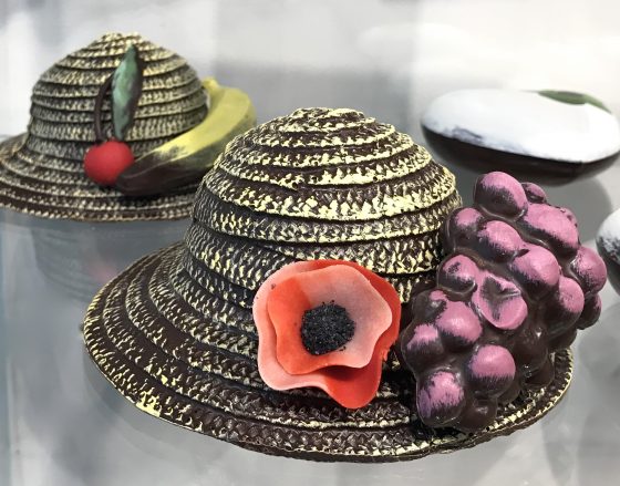Chocolate hats by Josephine Vannier, showing cultural traditions of chocolate and cocoa bean and fun facts about chocolate. (Image © Meredith Mullins.)