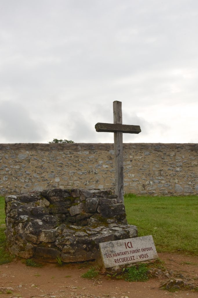 A mass grave in the center of Oradour-sur-Glane, an important part of the cultural history of WW II in France. (Image © Meredith Mullins.)