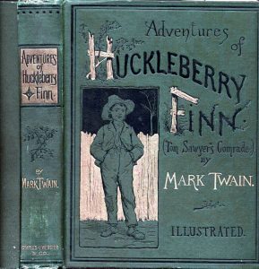 A vintage edition of The Adventures of Huckleberry Finn symbolizes wanderlust and the pleasures of reading while traveling. (public domain)