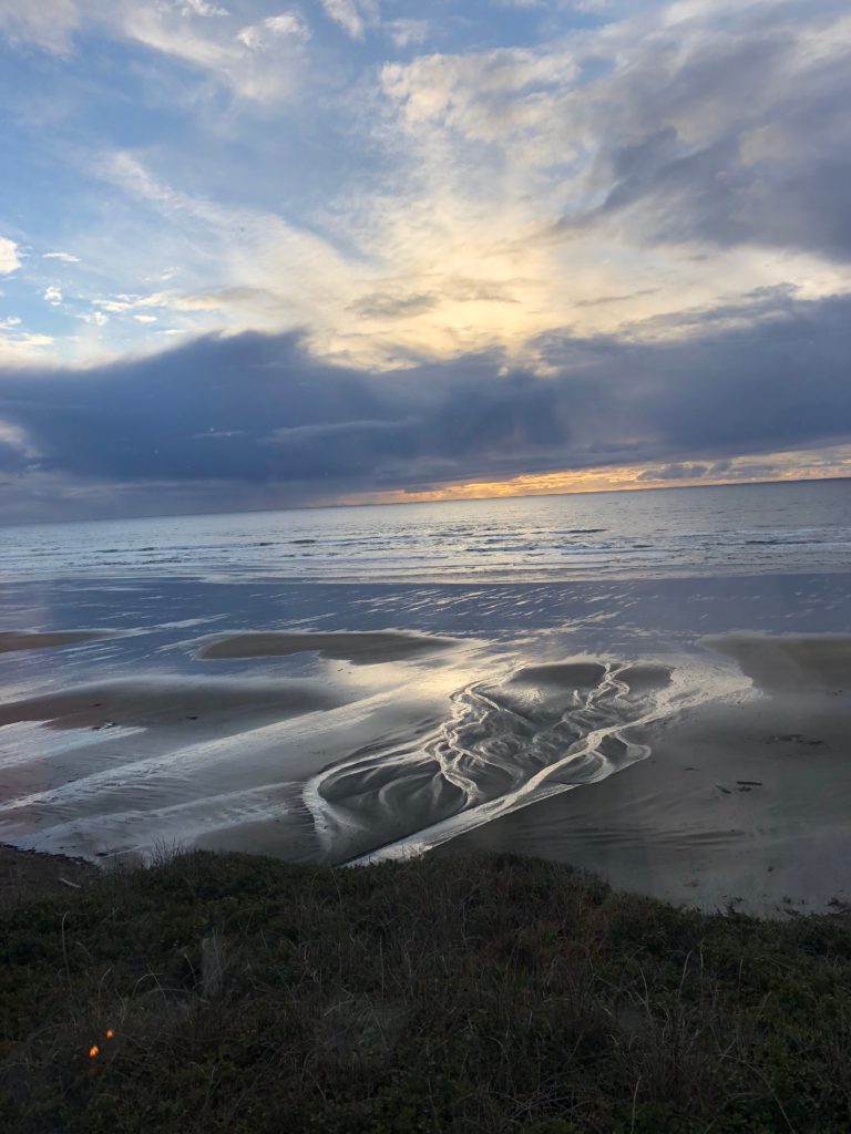 Sunset on the Oregon shore suggests why savoring summer can be a life-changing experience. (Image @ Joyce McGreevy)