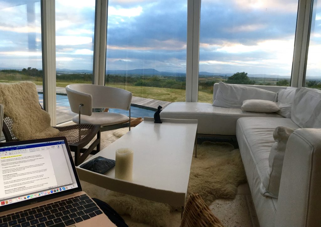 A conservatory in West Cork, Ireland becomes an office for a digital nomad. Image © by Joyce McGreevy