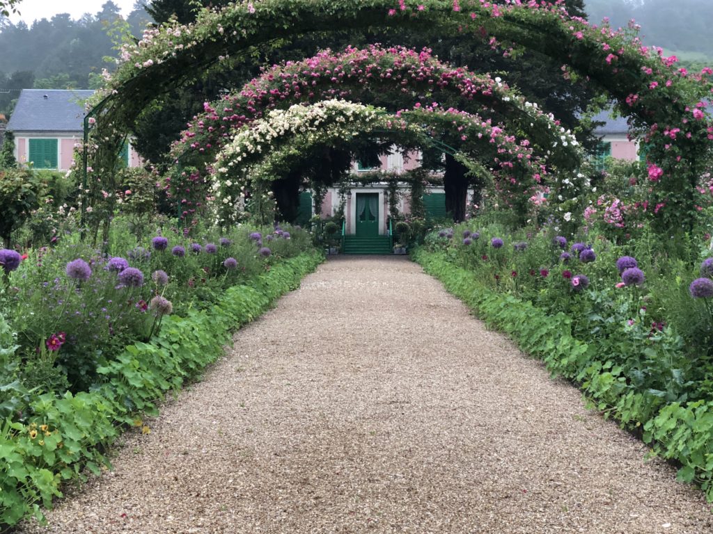 Monet's Clos Normand garden and the grand alley, travel inspiration in Giverny gardens. (Image © Elizabeth Murray.)