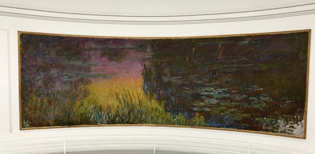 One of the nymphéas panels at the Musée de l'Orangerie, travel inspiration for Monet's Giverny gardens in France. (Image © Meredith Mullins.)