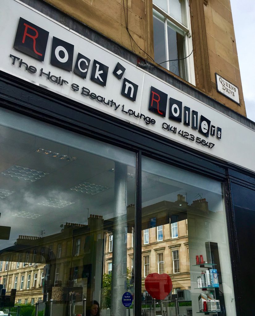 A hair salon in Glasgow, Scotland typifies the wit and wordplay of signage in public spaces. Image © Joyce McGreevy