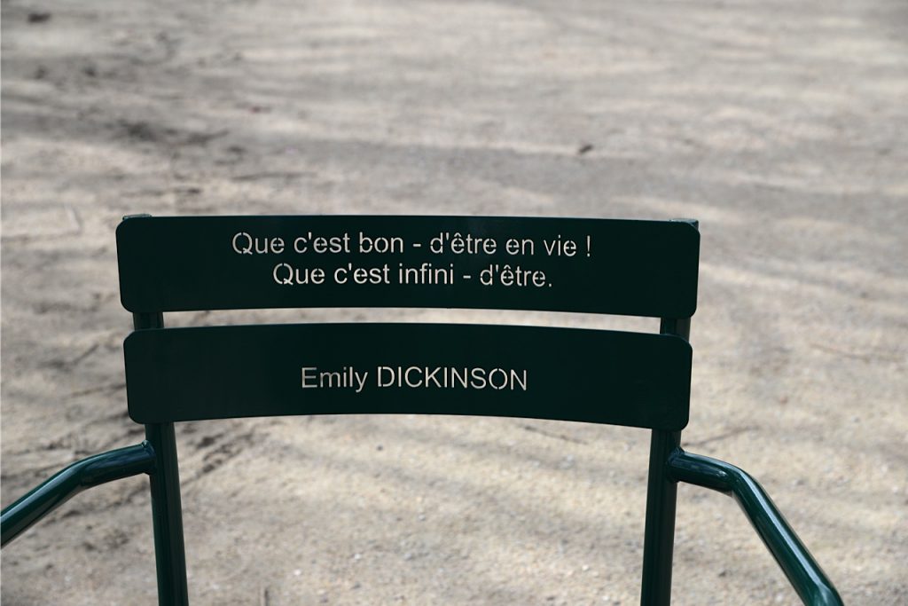 A poetry chair created by Michel Goulet for the Palais Royal gardens, Paris, honors Emily Dickinson and shows the wordplay, wit, and wisdom of signage in public spaces. Image © Meredith Mullins