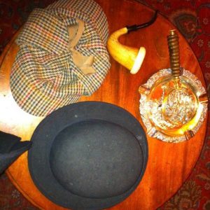 Hats, a pipe, and magnifying glass at the Sherlock Holmes Museum are London details and a travel inspiration. (© Joyce McGreevy)