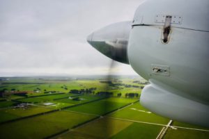 An airplane propeller over New Zealand reminds a writer that travel tips and travel advice don’t outrank personal travel discoveries. (Image © Joyce McGreevy)
