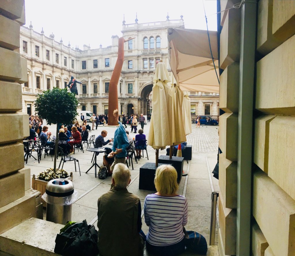 People outside a museum in London remind a writer that travel tips and travel advice don’t outrank personal travel discoveries. (Image © Joyce McGreevy)