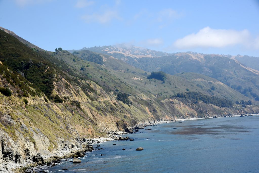 A view of the Big Sur coast, where seeking silence can open senses to challenge the cultural traditions of Labor Day. (Image © Meredith Mullins.)