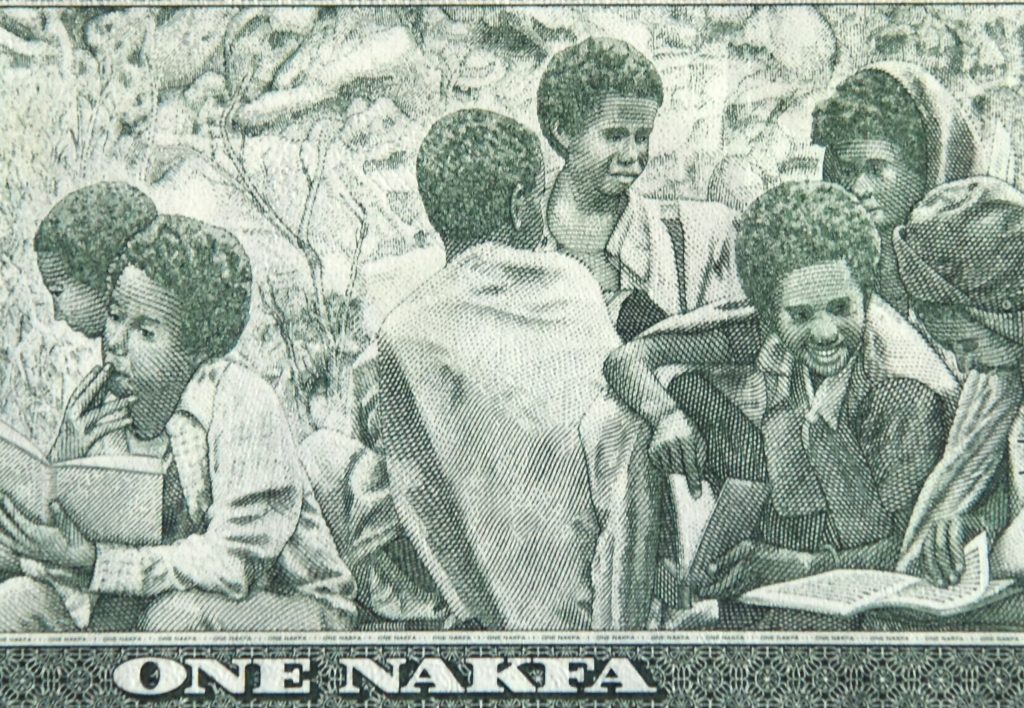 Eritrea banknote with boys being educated, a part of the world's paper money showing cultural heritage and traditions. (Image © Meredith Mullins.)