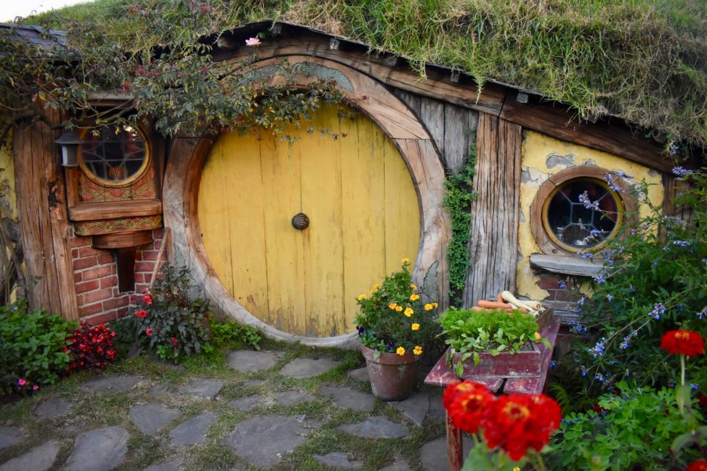 A facade in Hobbiton, New Zealand evokes the cross-cultural stories of doors and windows. (Image © Joyce McGreevy)