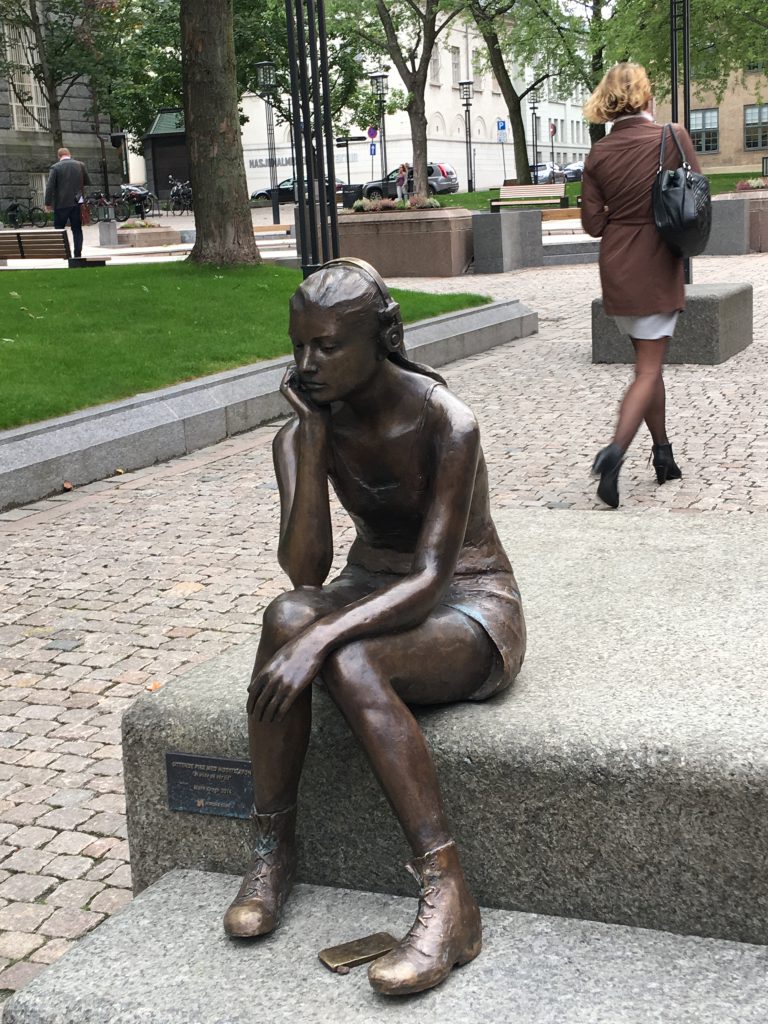 Marit Krogh's "Seated Girl with Headphones" in Oslo, Norway exemplifies the potential discoveries in urban peace and quiet (© Joyce McGreevy)