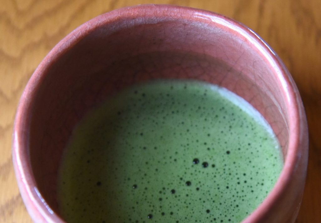 Bowl of matcha tea in a Japanese tea ceremony, showing the cultural traditions of Japan. (Image © Meredith Mullins.)