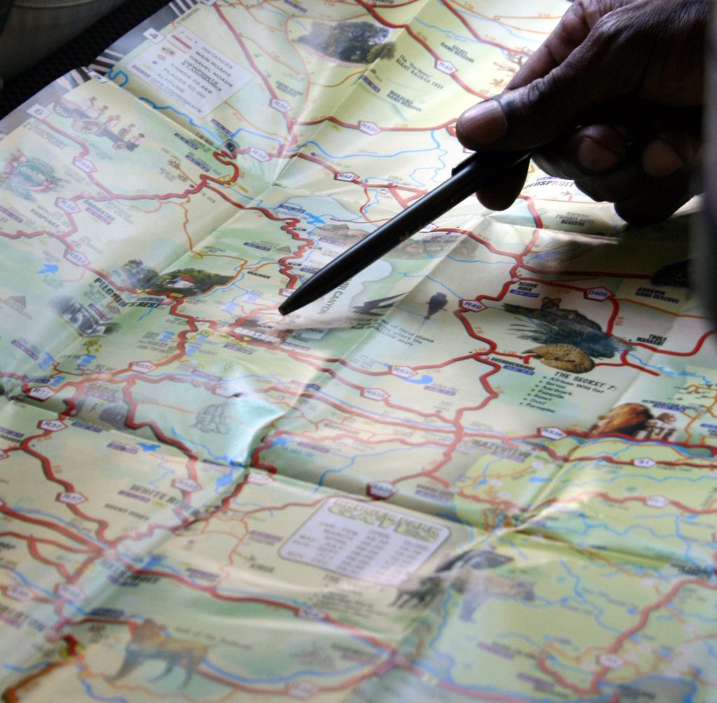 A hand tracing a route on a map suggests how local guides provide cultural context and elevates travel into a life-changing experience. Image © Keven A. Seaver