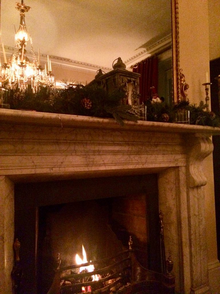 A glowing fireplace in Dublin, Ireland sets the scene for the Irish tradition of the party piece, sharing songs, stories, and poems. (Image © Joyce McGreevy)