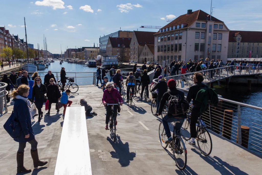 Cyclists and pedestrians cross a car-free bridge in Copenhagen, where creative thinking and Danish design influence the daily commute. (Image © Copenhagen Media Center and Thomas Rousing)