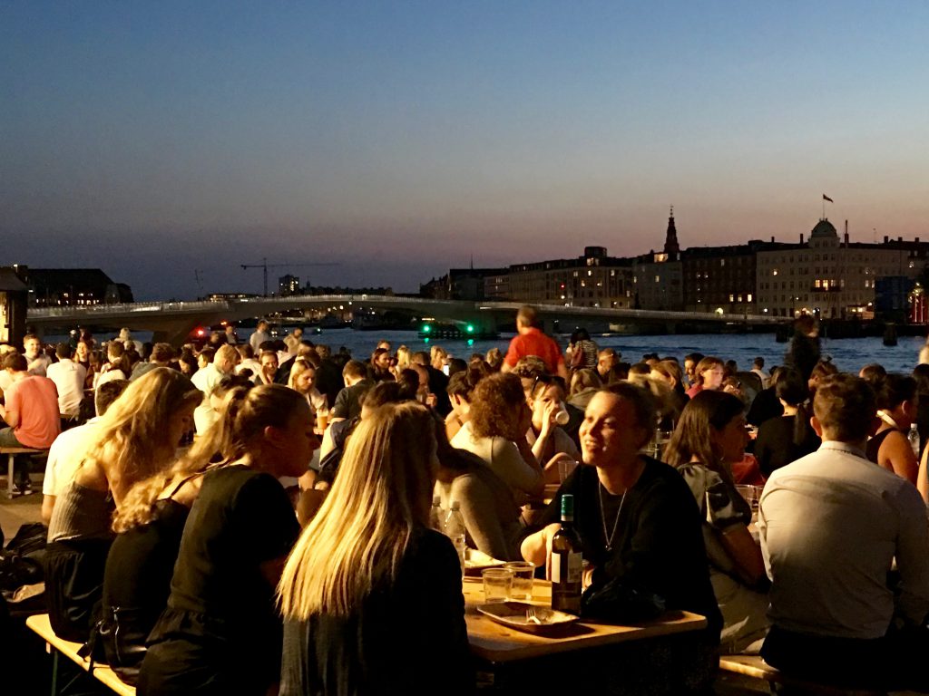 Outdoor diners at Papirøen, or Paper Island, a former storage facility, enjoy the benefits of Copenhagen's creative thinking toward Danish design. (Image © Joyce McGreevy)