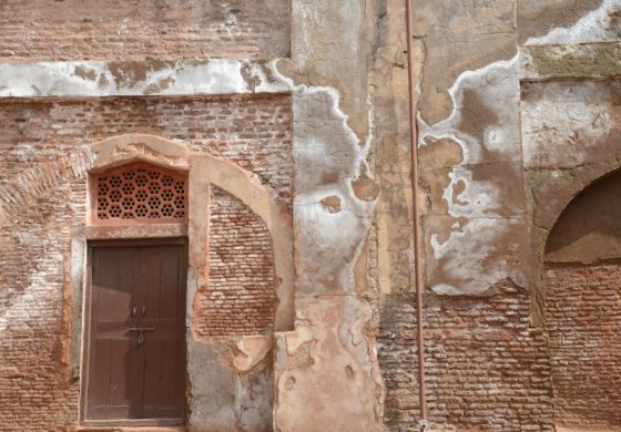 A brick building showing signs of wear proving the cultural traditions of Japanese wabi sabi and lending a theme for New Year's resolutions. (Image © Meredith Mullins.)