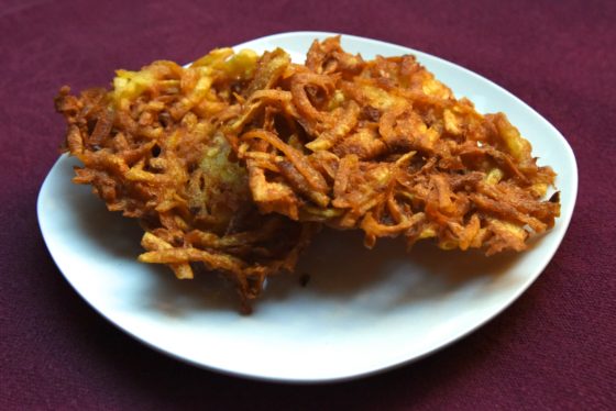 Plate of latkes, showing cultural traditions of the holiday season and holiday food around the world. (Image © Meredith Mullins.)
