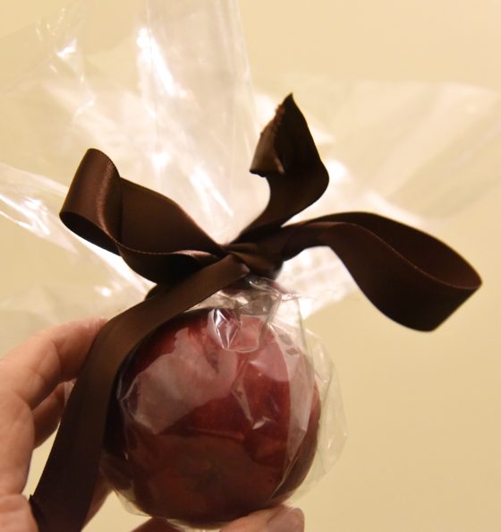 A cellophane wrapped apple, showing the cultural traditions of China for Christmas and holiday food around the world. (Image © Meredith Mullins.)