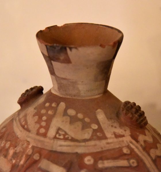 Old brown and tan vase with chips in the lip, showing the Japanese cultural traditions of wabi sabi and lending a theme for New Year's resolutions. (Image © Meredith Mullins.)