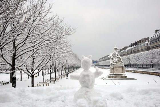 Snowman in a garden with classical statues and trees, showing the Japanese cultural traditions of wabi sabi and lending a theme for New Year's resolutions. (Image © Meredith Mullins.)