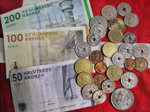 (Danish designed paper currency and coins may be phased out by 2025, as creative thinking influences monetary policy. 