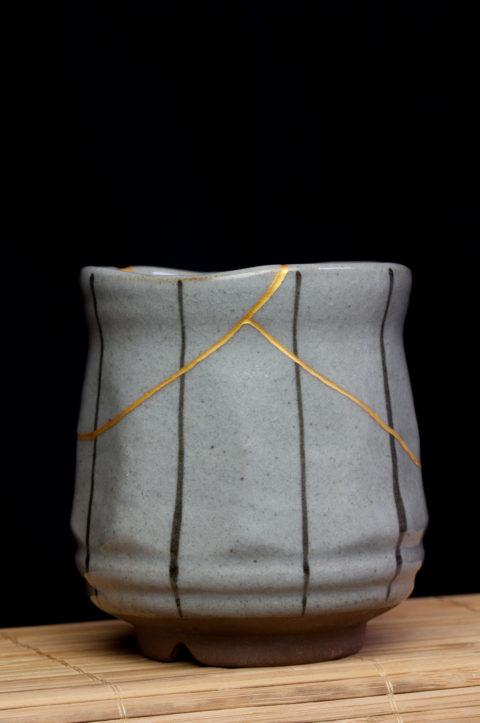 Small tea cup with kintsugi repair., showing the cultural traditions of Japanese wabi sabi, and lending a theme for New Year's resolutions. (Image © PhotoBeard/iStock.)
