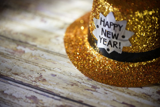 Happy new year hat on weathered boards, showing the cultural traditions of Japanese wabi sabi and lending a theme for New Year's resolutions. (Image © Kameleon007/iStock.)