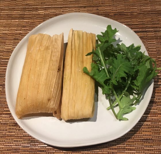 Plate of two tamales, showing the cultural traditions of Mexico for Christmas and holiday food around the world. (Image © Roberta J. Cobley.)