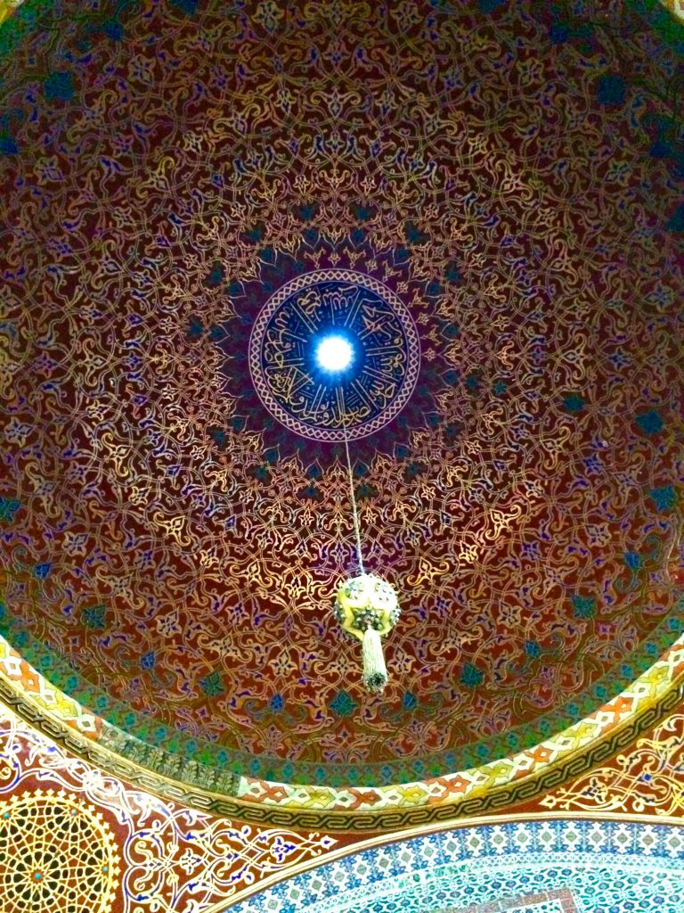 Light in a mosque in Istanbul, Turkey becomes a source of travel inspiration about traveling light. (Image © Joyce McGreevy)