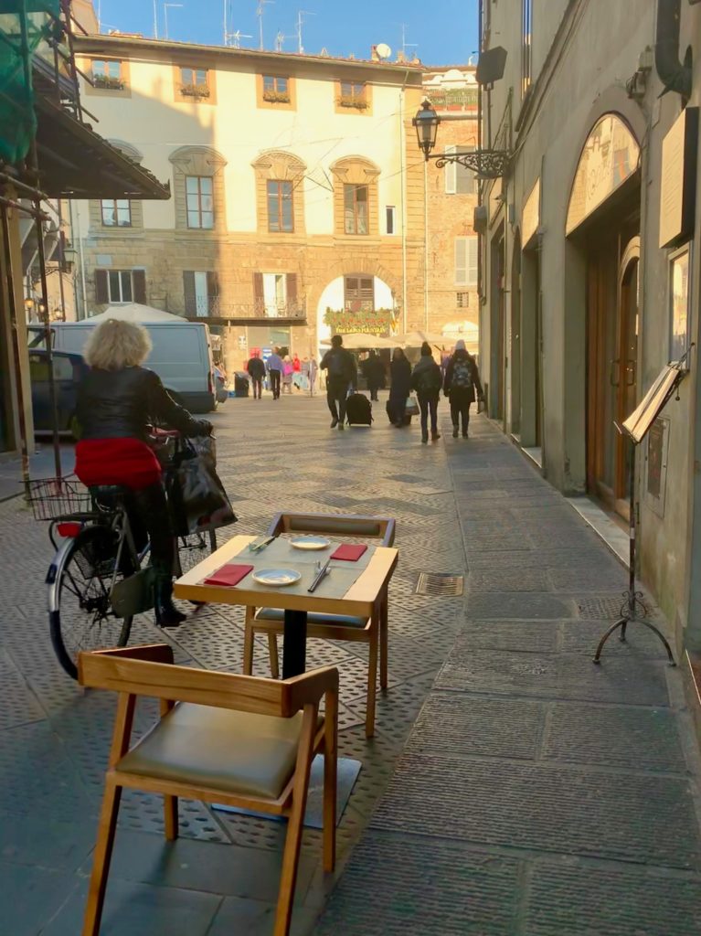 A street scene in Florence, Italy reflects a cultural tradition of savoring the winter holidays. (Image © Joyce McGreevy)