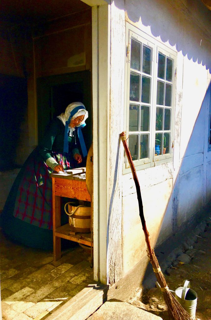 A woman re-enacts 17th century life in Aarhus, where such aha moments celebrate community history by rethinking it. (Image © Joyce McGreevy)