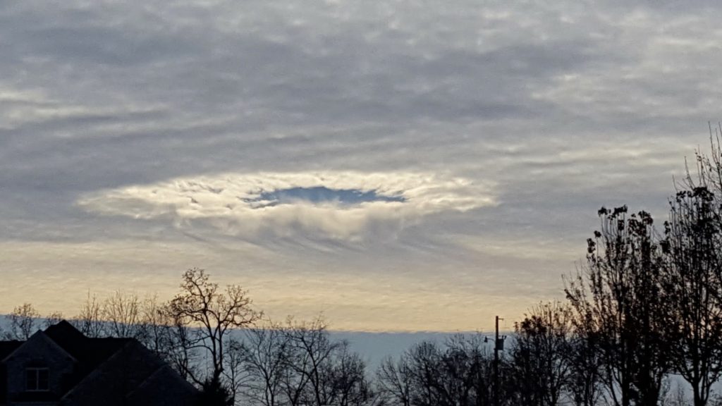 Cloud called Fallstreak Hole, cloud watching while traveling the world. (Image © Eric Pearson.)