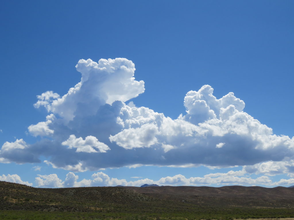 Cumulus clouds, part of cloud watching while traveling the world. (Image © DMT.)
