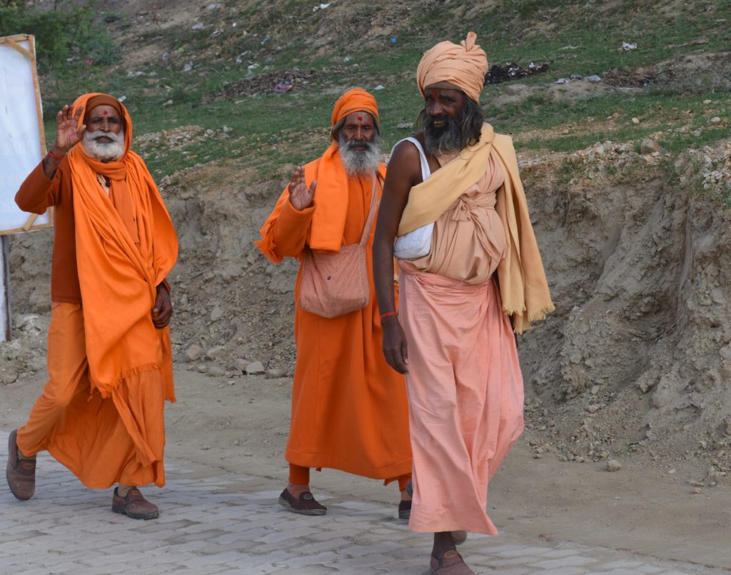 Pilgrims walking to the 2019 Ardh Kumbh Mela in Prayagraj (Allahabad), India, one of the amazing places in the world. (Image © Meredith Mullins.)