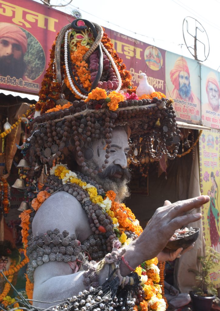 A baba giving blessings at the 2019 Ardh Kumbh Mela in Prayagraj (Allahabad), India, one of the amazing places win the world. (Image © Meredith Mullins.)