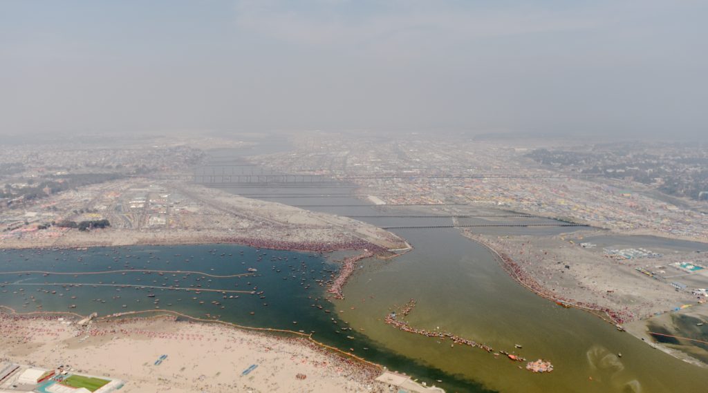 The Triveni Sangam at the Kumbh Mela in Prayagraj, India, where the Ganga and Yamuna rivers meet, one of the amazing places in the world. (Image © Meredith Mullins.)