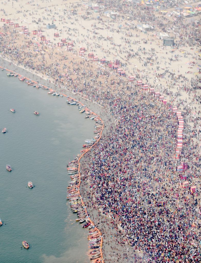 Aerial shot of the Basant Panchami main bathing day of the 2019 Kumbh Mela in Prayagraj, India, one of the amazing places of the world (Image © Meredith Mullins.)