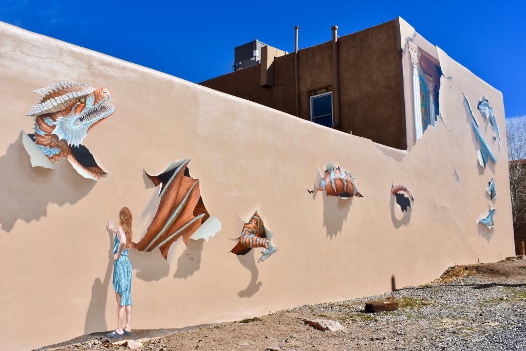 A trompe l'oeil mural at Big Adventure Comics shows why Santa Fe, New Mexico inspires wanderlust. (Image © Joyce McGreevy)