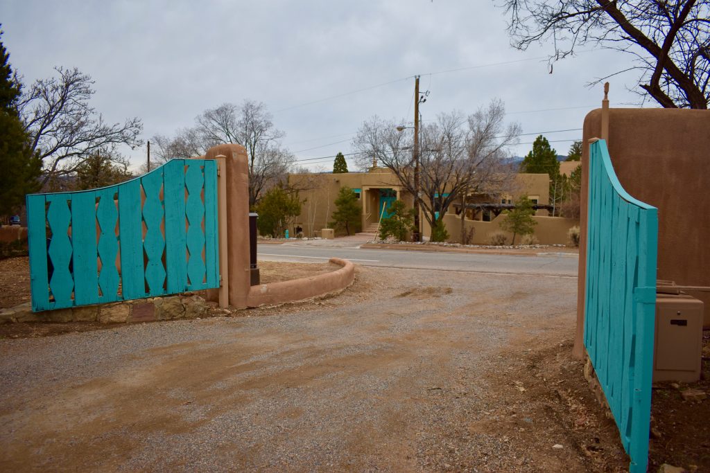 Turquoise gates at the School for American Research show why Santa Fe, New Mexico inspires wanderlust. (Image © Joyce McGreevy)