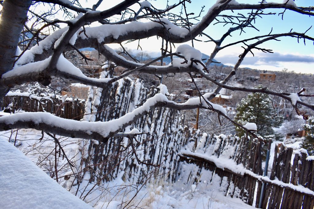 A snowy, high-desert landscape shows why Santa Fe, New Mexico inspires wanderlust. (Image © Joyce McGreevy)