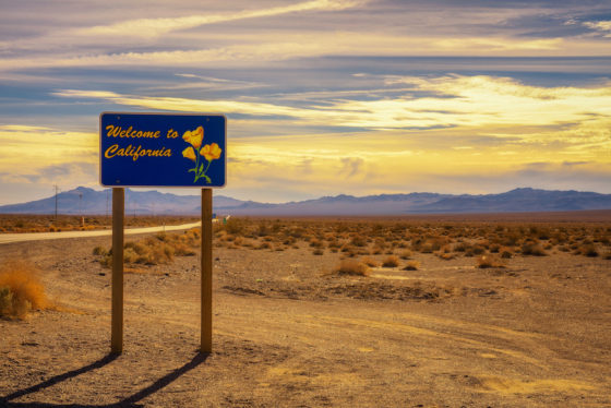 Welcome to California road sign, encouraging the art of travel. (Image © iStock/Mirolslav1.)