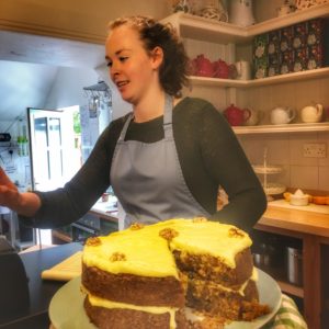A baker and cake at Burren Cafe, Co. Clare show how Ireland’s culinary renaissance has dispelled stereotypes about Irish cuisine. (Image © Joyce McGreevy)