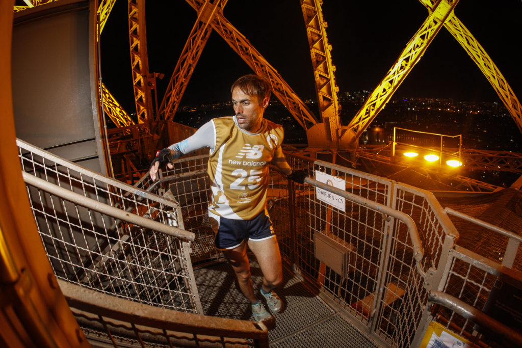 ECOTRAILORGA_CHRISTOPHEGUIARD_Laurent Vincente runs in the Eiffel Tower Vertical race at one of the most amazing places on earth. (Photo © EcoTrail Organization.)