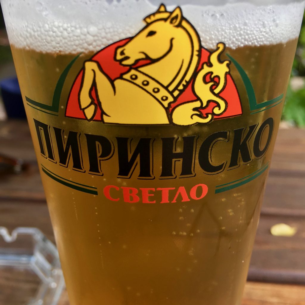 Bulgarian lettering on a beer glass helps the author understand that learning a second language will mean learning a second alphabet, Cyrillic. (Image © Joyce McGreevy)