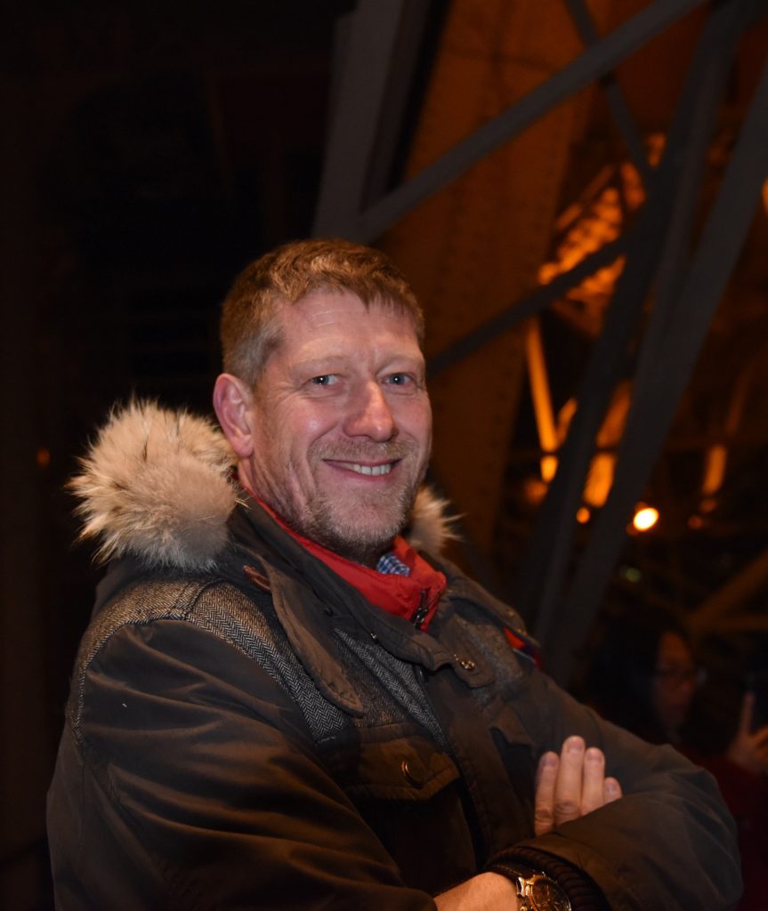 Jean-Charles Perrin, founder of the Eiffel Tower Vertical race, at the Eiffel Tower, one of the most amazing places on earth. (Image © Meredith Mullins.)