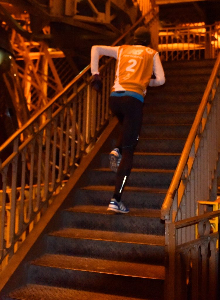 Runner #2 climbs the stairs of the Eiffel Tower Vertical at one of the most amazing places on earth. (Image © Meredith Mullins.)