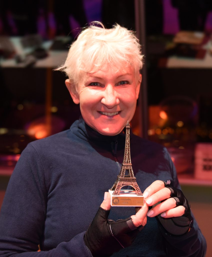 Janet Goodwin, an entry in the Eiffel Tower Vertical race came to one of the amazing places in the world for this tower race. (Image © Meredith Mullins.)