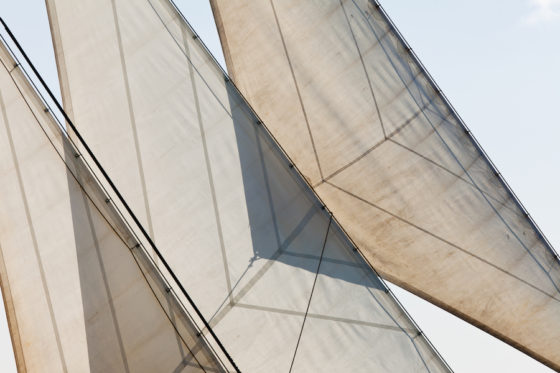 Yacht sails and rigging demonstrating the idiom three sheets to the wind, one of the proverbs and sayings that is used often in the English language. (Image © iStock/Pi-lens.)